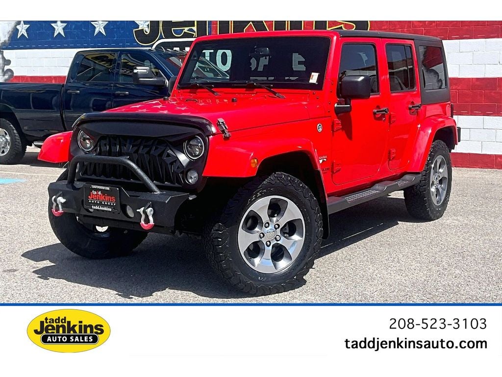 2017 Jeep Wrangler Sahara in Firecracker Red — front three-quarter view